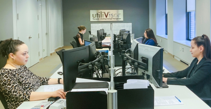 utiliVisor's billing operations center in New York with employees at desk working