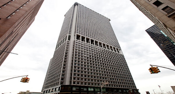 a tall office building in New York with many windows