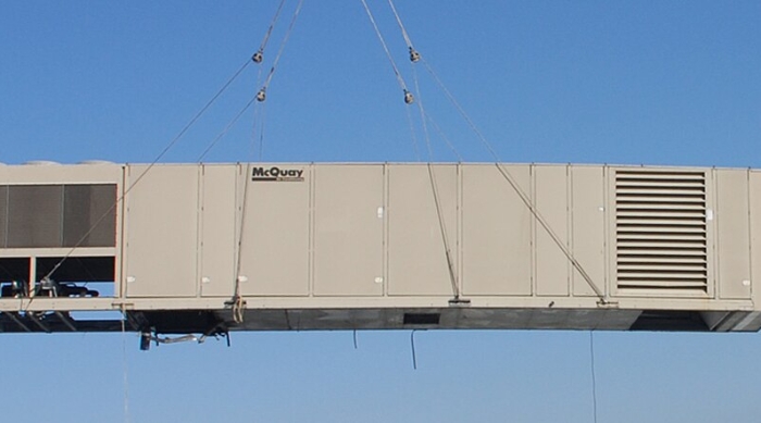 Air handling unit being craned into place. Source: Los Angeles Air Force Base Space and Missile System Center, Public domain, via Wikimedia Common.