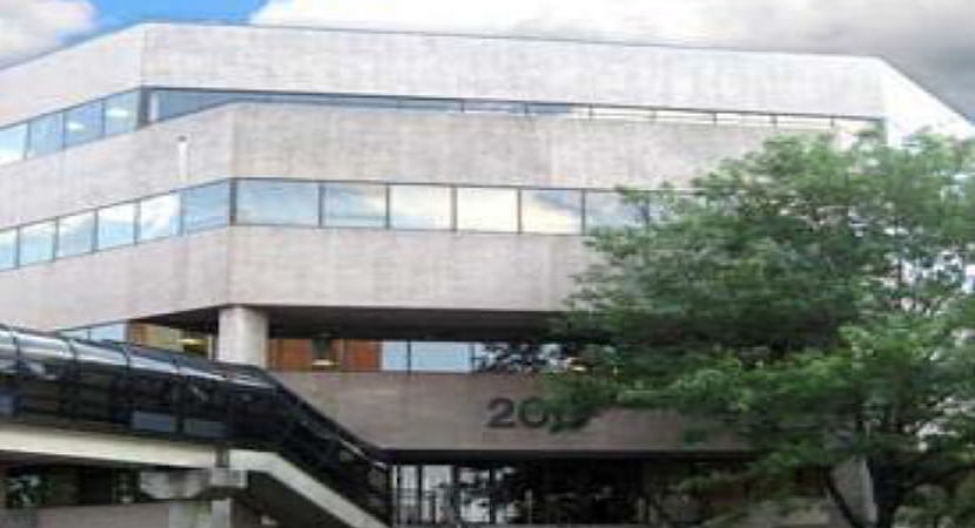 a building at 200 Plaza Drive with a bridge connecting to the entrance