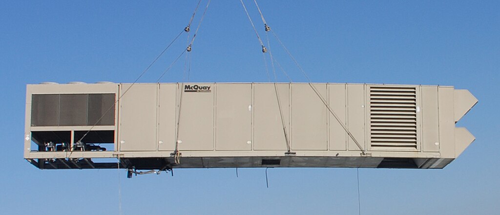Air handling unit being craned into place. Source: Los Angeles Air Force Base Space and Missile System Center, Public domain, via Wikimedia Common.